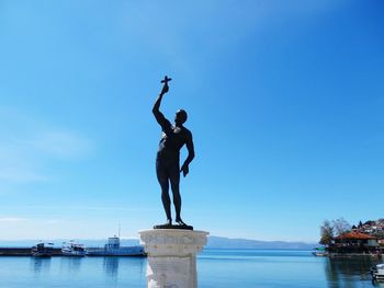 Fountain against blue sky