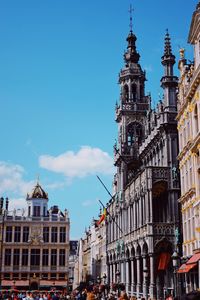 Low angle view of buildings in city against sky