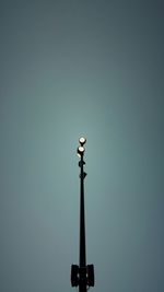 Low angle view of street light against clear sky