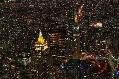 Illuminated buildings in city at night