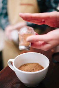 Close-up of coffee cup on table