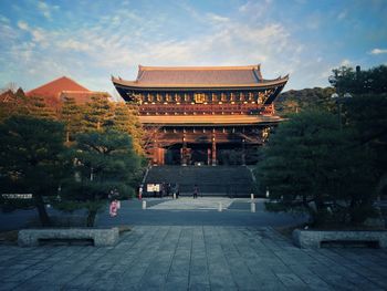 Temple amidst trees against sky