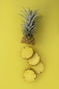 Close-up of fruit against yellow background