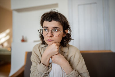 Portrait of young woman looking away