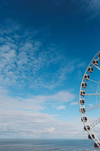 Ferris wheel against blue sky