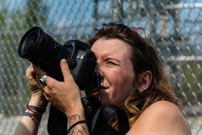 Portrait of woman photographing