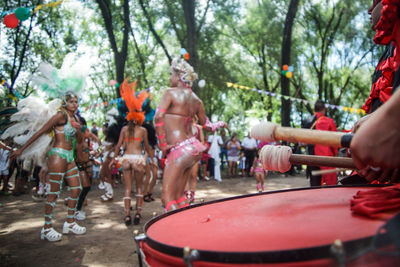 People performing on field during festival