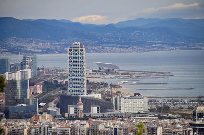 High angle view of buildings in city against sky