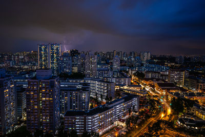 High angle view of illuminated city buildings at night