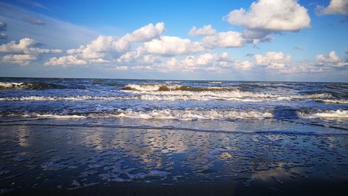 Scenic view of sea against blue sky