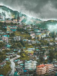 High angle view of townscape against cloudy sky