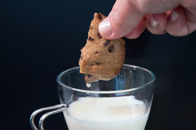 Close-up of hand holding drink