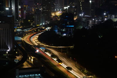 High angle view of light trails on city street at night