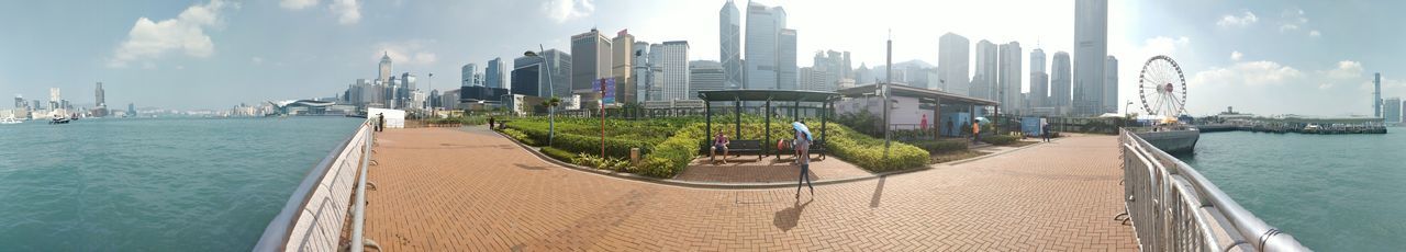 building exterior, architecture, built structure, water, sky, city, panoramic, office building exterior, building, nature, skyscraper, sea, transportation, cityscape, day, cloud - sky, travel destinations, office, landscape, outdoors, tall - high, no people, modern, financial district