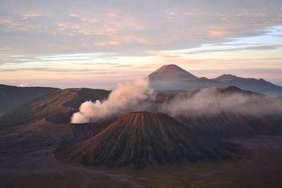 View of volcanic landscape against cloudy sky