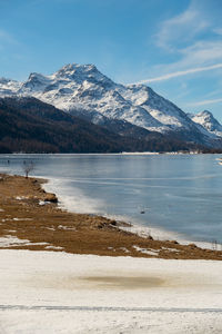Switzerland, february 21, 2023 panorama with the lake of silvaplana and the mount corvatsch 