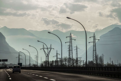 Cars on road against sky