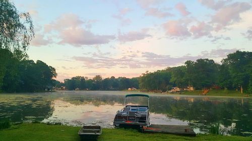 Scenic view of lake against cloudy sky