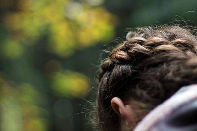 Cropped image of woman with braided hair