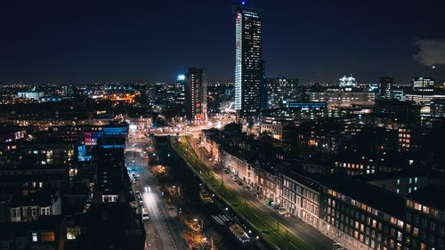 Aerial view of city lit up at night