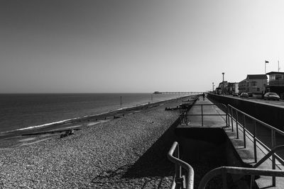 Pier over sea against clear sky
