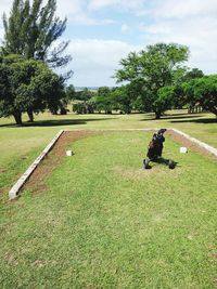 Man on field against sky in park