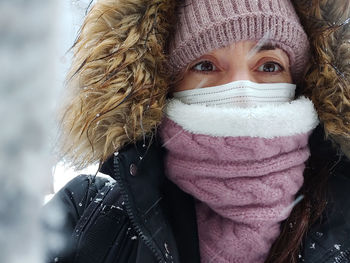 Portrait of woman wearing hat during winter