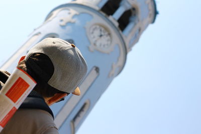Rear view of man against clear sky