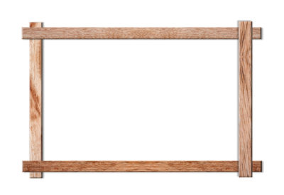 Close-up of wooden frame against white background
