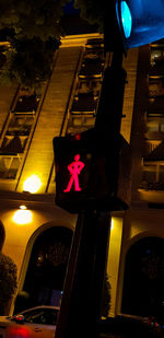 Low angle view of illuminated building at night