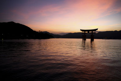 Scenic view of lake against sky during sunset