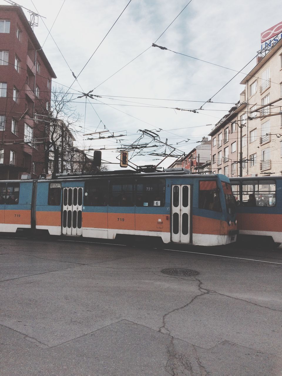 built structure, sky, transportation, building exterior, architecture, no people, mode of transport, outdoors, land vehicle, public transportation, connection, day, telephone line