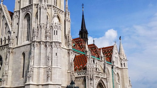 Low angle view of church against blue sky