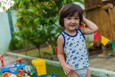 Portrait of cutw boy standing outdoors