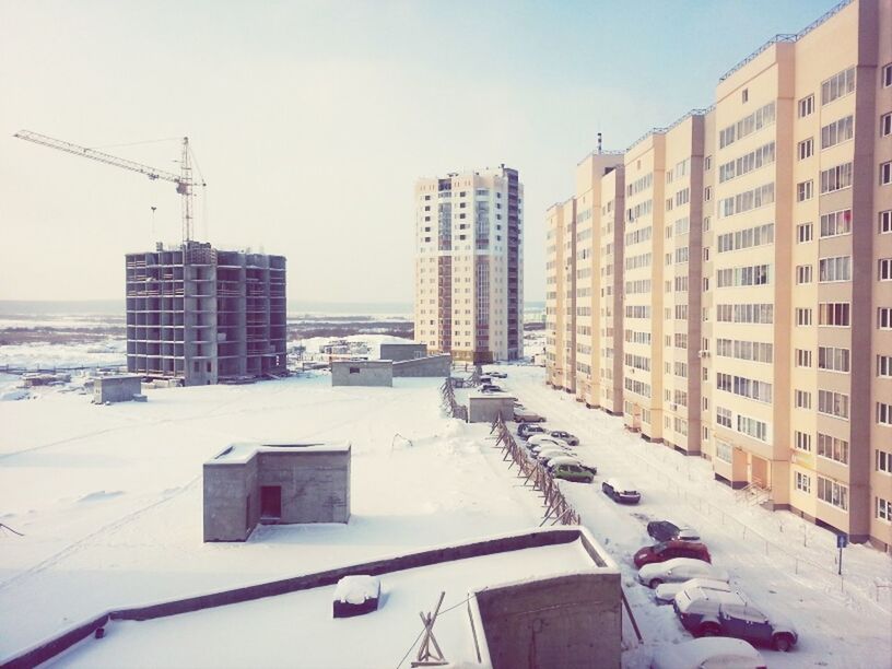 building exterior, architecture, built structure, clear sky, snow, residential structure, winter, residential building, city, cold temperature, house, building, transportation, day, outdoors, residential district, sky, sunlight, no people, season