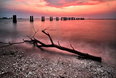 Scenic view of sea against sky during sunset