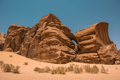 Rock formations in desert against sky