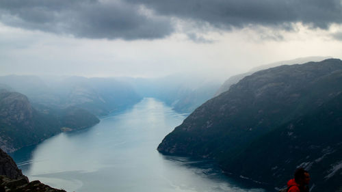 Scenic view of mountains against cloudy sky