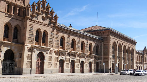 Facade of historic building against sky