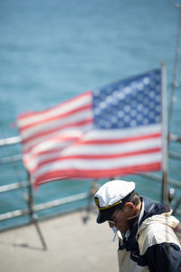 Close-up of flag on sea