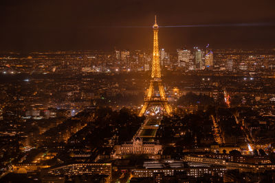 Aerial view of illuminated city buildings at night