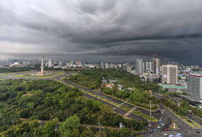 City buildings against cloudy sky