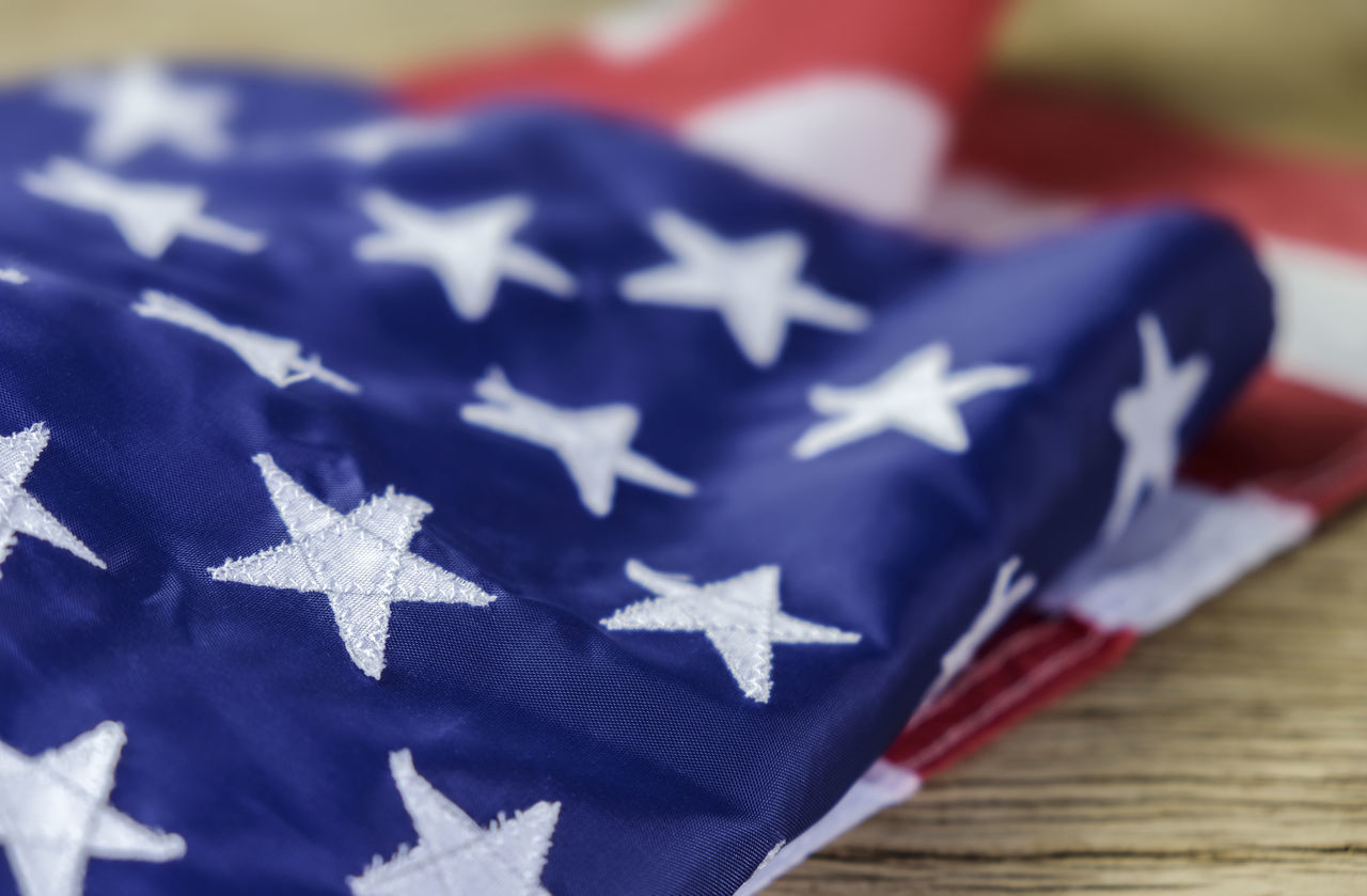 CLOSE-UP OF FLAG ON TABLE