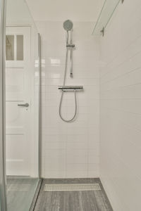 Low angle view of shower head in bathroom