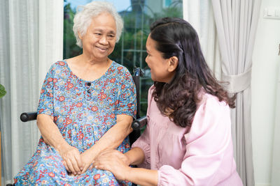 Portrait of mother and daughter at home