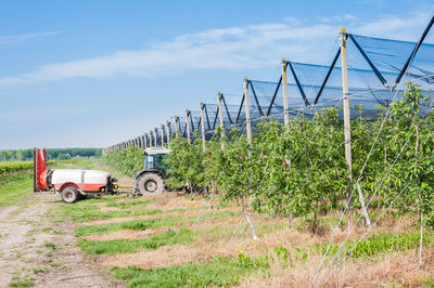 Tractor on field against sky