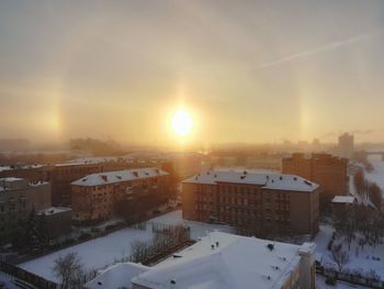High angle view of buildings in city during winter