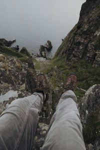 Low section of man on rock