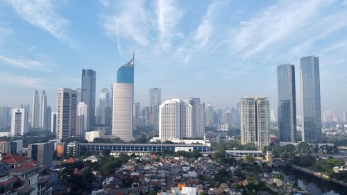 Modern buildings in city against sky