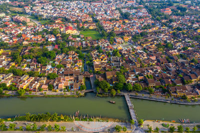 High angle view of plants and buildings in city